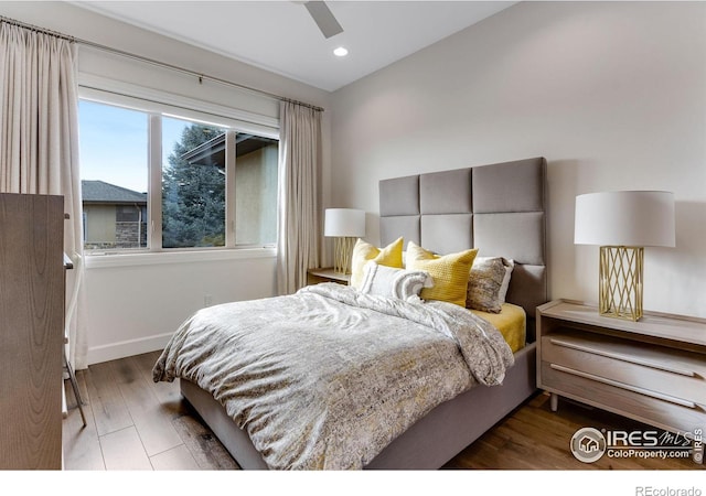 bedroom featuring baseboards, wood finished floors, recessed lighting, and a ceiling fan