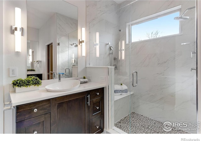full bath featuring a shower stall and vanity