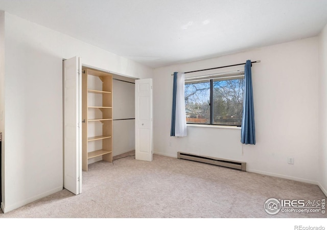 925 Columbia Rd Unit 233, Fort Collins, CO 80525 - unfurnished bedroom with a closet, carpet floors, baseboards, and baseboard heating
