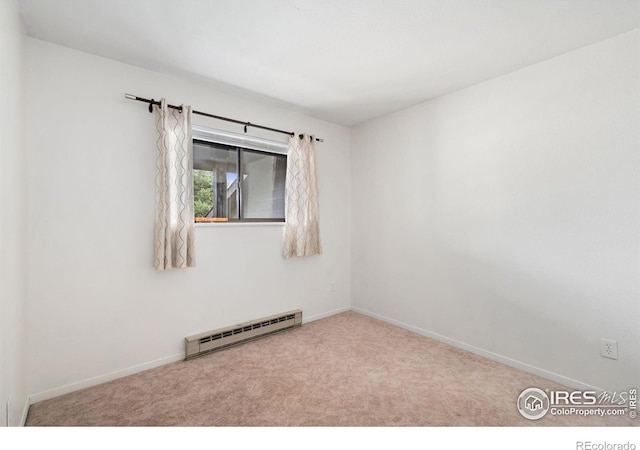 925 Columbia Rd Unit 233, Fort Collins, CO 80525 - spare room featuring a baseboard radiator, baseboards, and carpet flooring