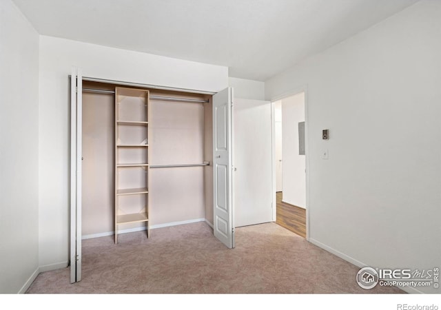 925 Columbia Rd Unit 233, Fort Collins, CO 80525 - unfurnished bedroom featuring a closet, baseboards, and carpet