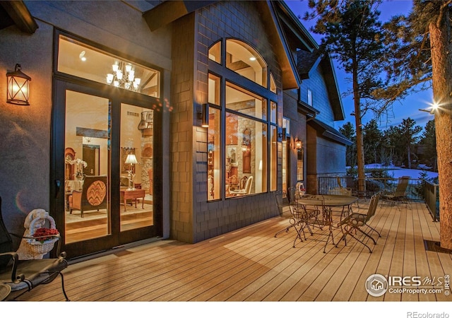 2251 Fox Acres Dr E, Red Feather Lakes, CO 80545 - wooden deck featuring outdoor dining area