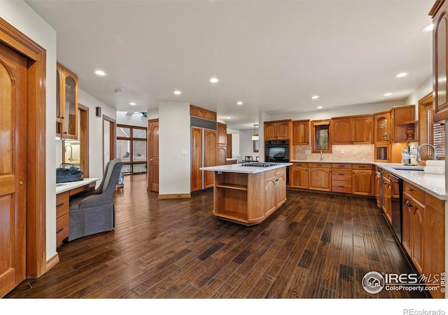 kitchen with light countertops, a sink, open shelves, dark wood-style floors, and backsplash