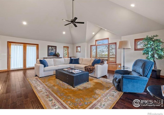 living room with high vaulted ceiling, wood finished floors, baseboards, ceiling fan, and recessed lighting