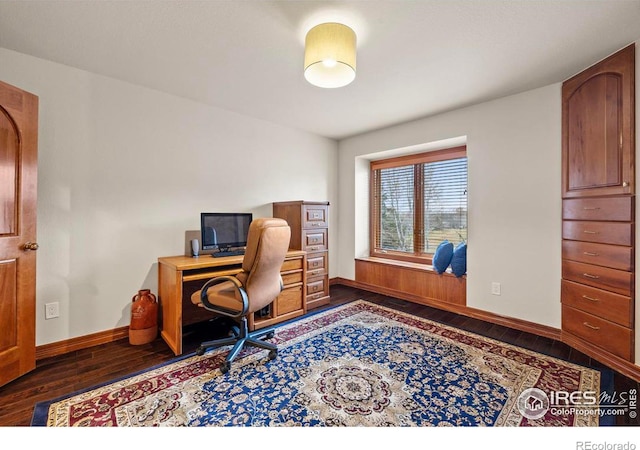 office area featuring baseboards and hardwood / wood-style flooring