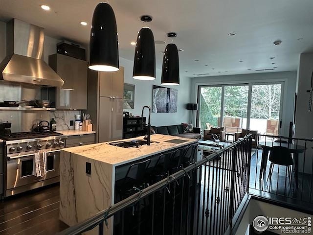 100 E Cooper Ave E Unit 7, Aspen, CO 81611 - kitchen with wall chimney range hood, a sink, double oven range, tasteful backsplash, and dark wood-style flooring