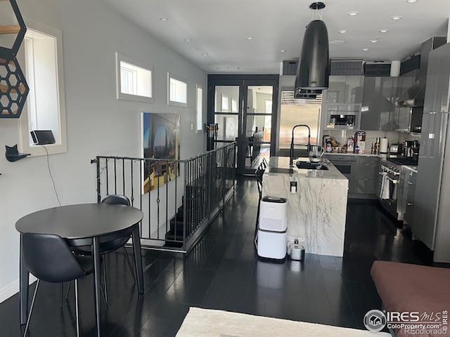 100 E Cooper Ave E Unit 7, Aspen, CO 81611 - kitchen featuring a sink, decorative light fixtures, dark wood finished floors, appliances with stainless steel finishes, and recessed lighting