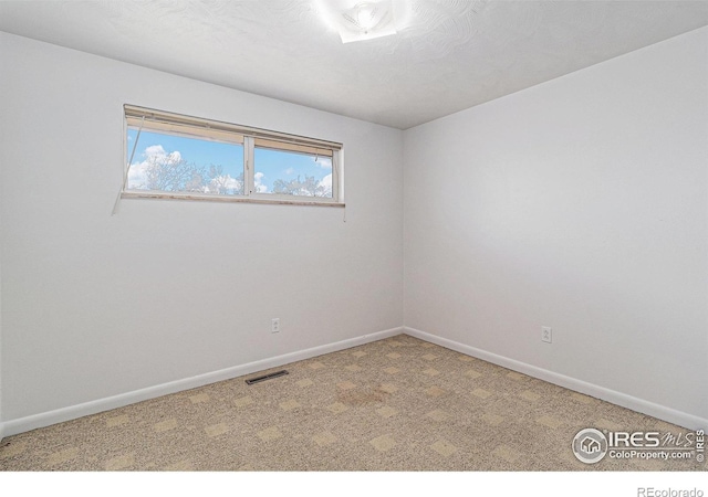 2 Lincoln Pl, Longmont, CO 80501 - carpeted empty room with baseboards