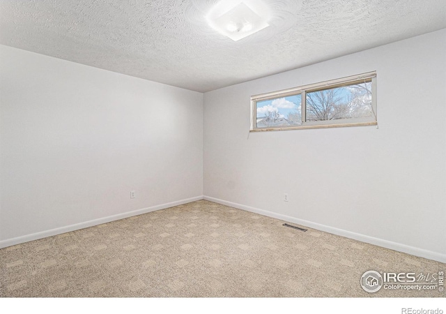 2 Lincoln Pl, Longmont, CO 80501 - empty room featuring carpet, baseboards, and a textured ceiling