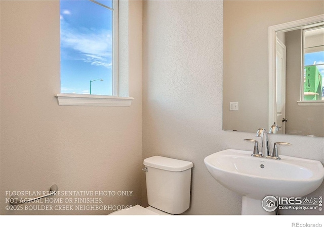 2387 Bristol St, Superior, CO 80027 - half bath with a sink and toilet