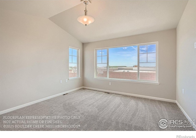 2387 Bristol St, Superior, CO 80027 - empty room featuring carpet floors, vaulted ceiling, and baseboards