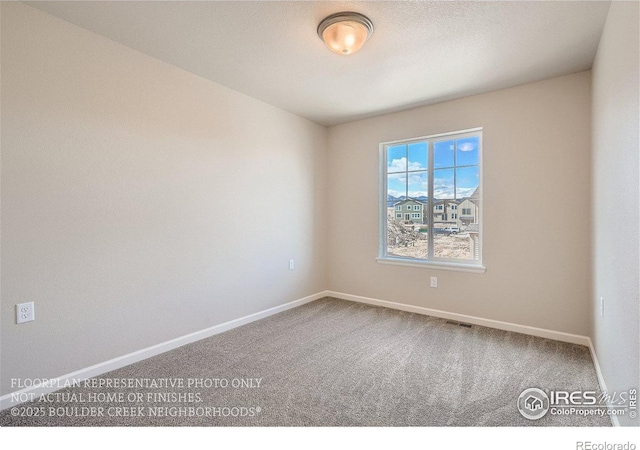 2387 Bristol St, Superior, CO 80027 - spare room featuring carpet flooring and baseboards