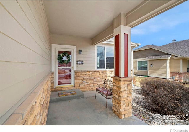 2747 Dafina Dr, Loveland, CO 80537 - entrance to property featuring stone siding