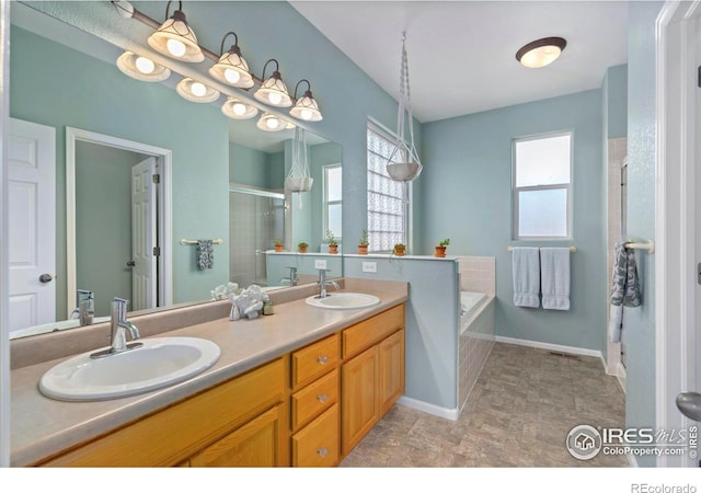 2747 Dafina Dr, Loveland, CO 80537 - full bathroom featuring a shower stall, a sink, and a healthy amount of sunlight