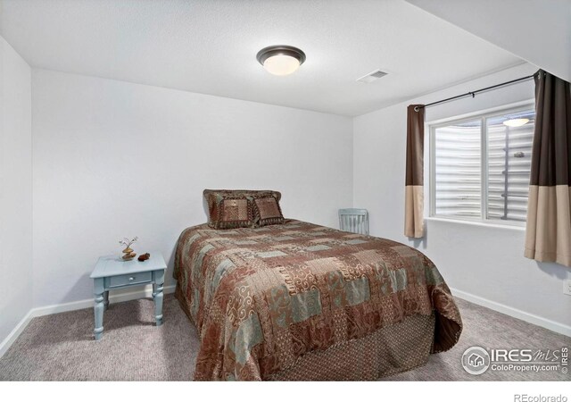 2747 Dafina Dr, Loveland, CO 80537 - carpeted bedroom with visible vents and baseboards