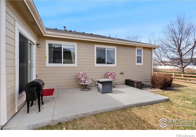2747 Dafina Dr, Loveland, CO 80537 - rear view of property with a lawn, fence, and a patio area