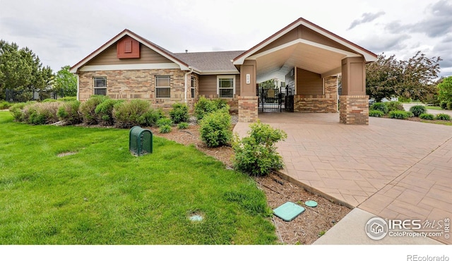 2747 Dafina Dr, Loveland, CO 80537 - craftsman inspired home featuring fence, stone siding, brick siding, a front yard, and a gate