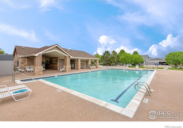 2747 Dafina Dr, Loveland, CO 80537 - community pool featuring a patio