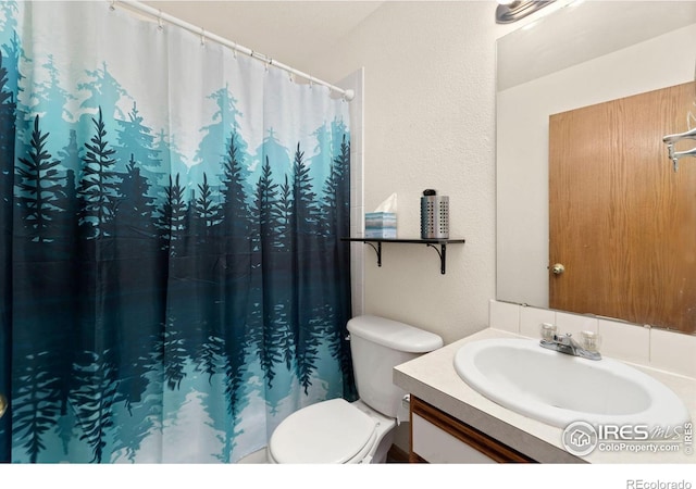 3005 Ross Dr Unit U17, Fort Collins, CO 80526 - full bath with vanity, a textured wall, and a shower with curtain
