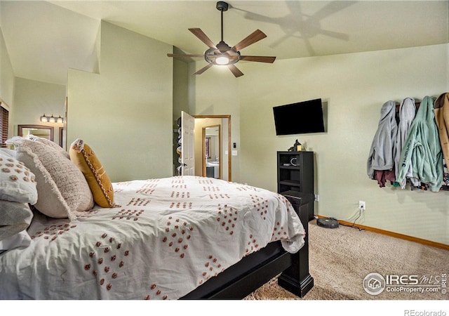 7889 Antelope Ct, Wellington, CO 80549 - carpeted bedroom featuring baseboards, vaulted ceiling, and ceiling fan