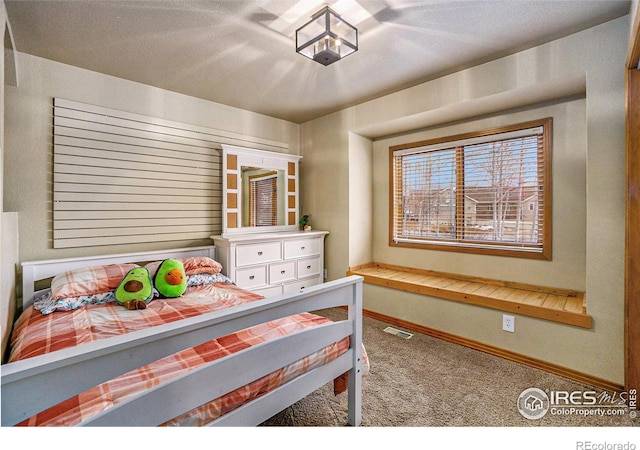 7889 Antelope Ct, Wellington, CO 80549 - bedroom featuring carpet flooring, baseboards, and visible vents