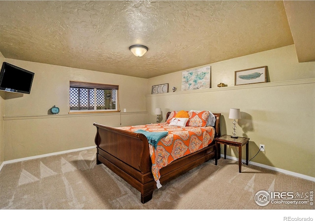 7889 Antelope Ct, Wellington, CO 80549 - carpeted bedroom with baseboards and a textured ceiling