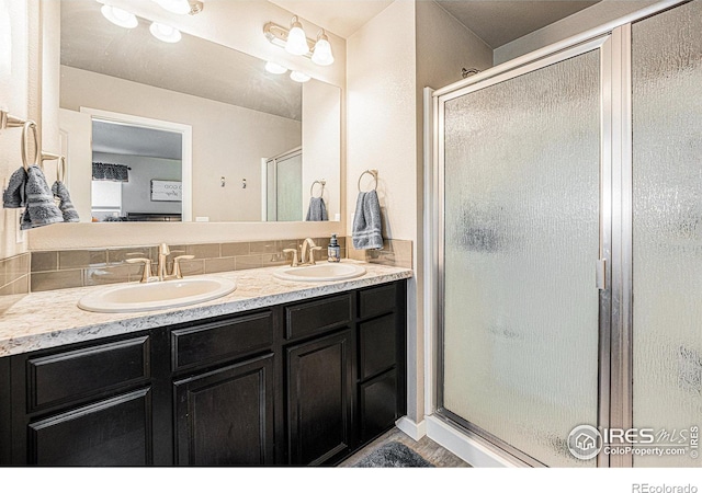 1108 Osprey Way, Wiggins, CO 80654 - bathroom with double vanity, a sink, and a shower stall