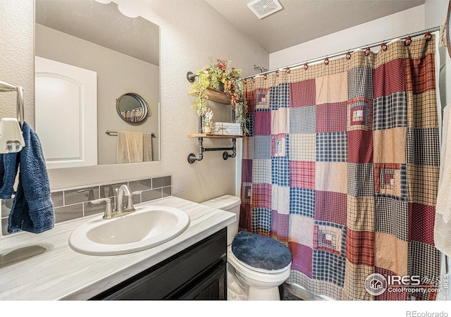 1108 Osprey Way, Wiggins, CO 80654 - full bath with vanity, toilet, a textured wall, a shower with shower curtain, and visible vents