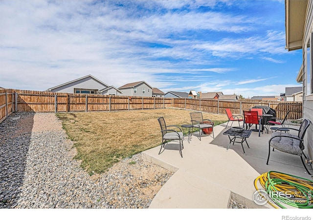 1108 Osprey Way, Wiggins, CO 80654 - view of yard with a fenced backyard, outdoor dining space, and a patio area