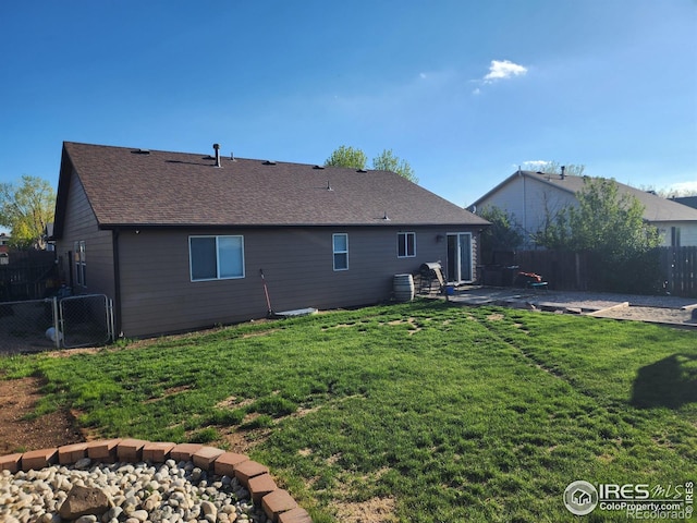 273 S 5th St, Way, La Salle, CO 80645 - back of property with a patio area and a shingled roof