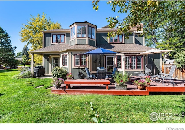 6850 Frying Pan Rd, Boulder, CO 80301 - back of property with a wooden deck, a yard, and roof with shingles