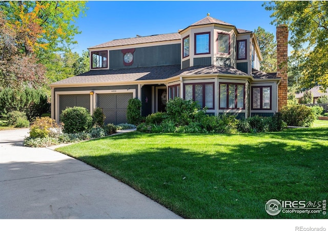 6850 Frying Pan Rd, Boulder, CO 80301 - victorian home with a garage, a front lawn, driveway, and a shingled roof