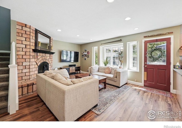 6850 Frying Pan Rd, Boulder, CO 80301 - living area featuring wood finished floors, stairs, a fireplace, recessed lighting, and baseboards