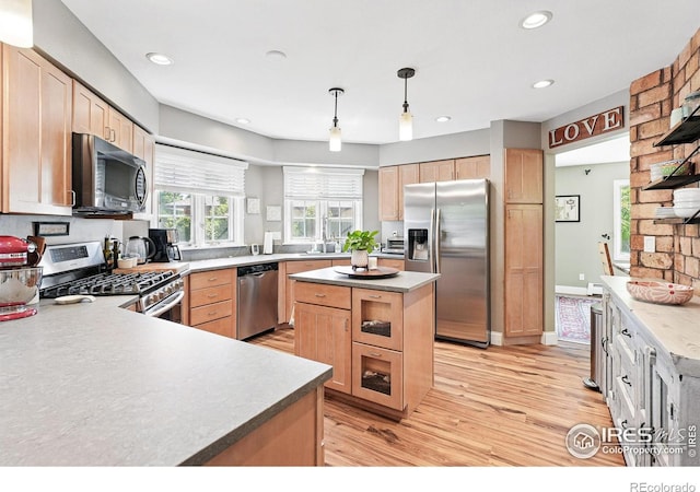 6850 Frying Pan Rd, Boulder, CO 80301 - kitchen featuring stainless steel appliances, light brown cabinets, light wood-style floors, recessed lighting, and pendant lighting