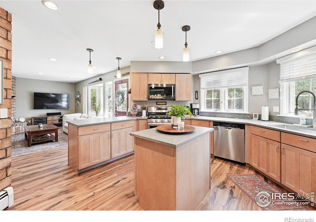 6850 Frying Pan Rd, Boulder, CO 80301 - kitchen with stainless steel appliances, a sink, light brown cabinets, light wood finished floors, and recessed lighting