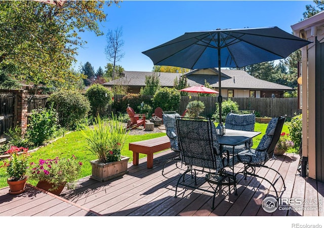 6850 Frying Pan Rd, Boulder, CO 80301 - wooden deck featuring a fenced backyard, outdoor dining area, and a fire pit