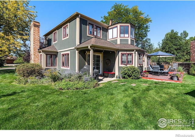 6850 Frying Pan Rd, Boulder, CO 80301 - view of front of home featuring a chimney, a patio area, and a shingled roof