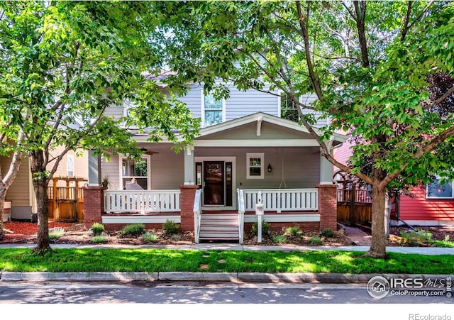 4351 W 118th Way, Westminster, CO 80031 - view of front of home with covered porch and brick siding