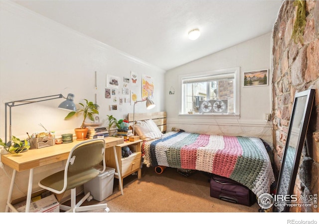 bedroom with carpet flooring, ornamental molding, and lofted ceiling