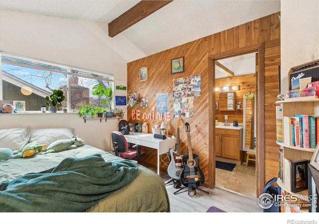 bedroom featuring lofted ceiling with beams and wooden walls