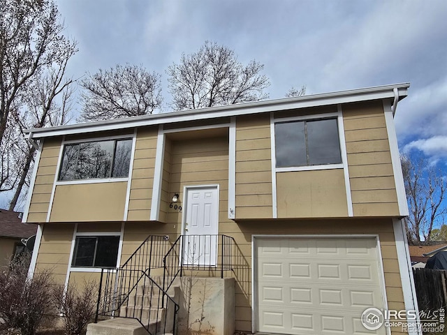 609 Andrea St, Fort Collins, CO 80524 - split foyer home featuring a garage