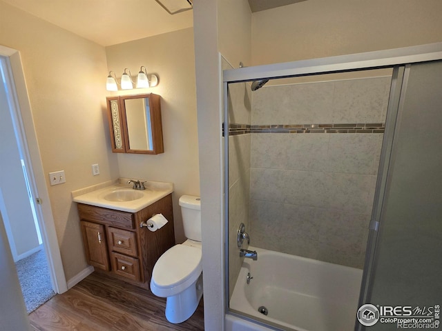 609 Andrea St, Fort Collins, CO 80524 - full bath featuring wood finished floors, toilet, bathtub / shower combination, and vanity