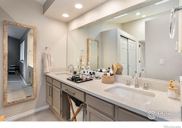 4808 Hopkins Pl, Boulder, CO 80301 - bathroom with double vanity, baseboards, and recessed lighting