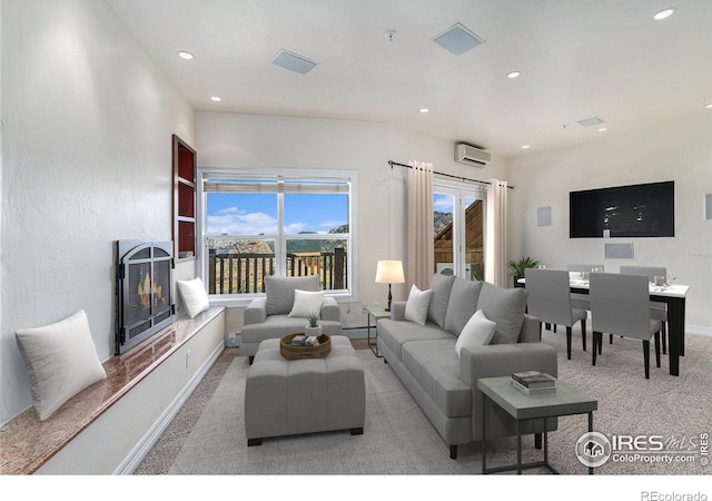 2625 Marys Lake Rd Unit S2, Estes Park, CO 80517 - carpeted living area with a wall mounted AC, a high end fireplace, baseboards, recessed lighting, and a baseboard heating unit