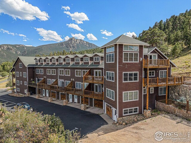 2625 Marys Lake Rd Unit S2, Estes Park, CO 80517 - view of property with driveway, an attached garage, a mountain view, and a residential view