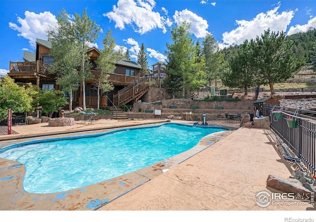2625 Marys Lake Rd Unit S2, Estes Park, CO 80517 - pool featuring a patio, fence, stairway, and a deck