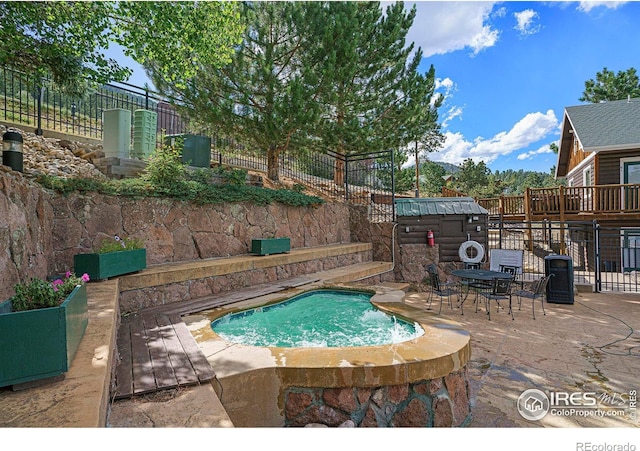 2625 Marys Lake Rd Unit S2, Estes Park, CO 80517 - view of pool featuring a wooden deck, fence, outdoor dining area, and a patio