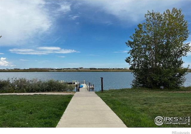 2449 Trio Falls Dr, Loveland, CO 80538 - dock area with a lawn and a water view