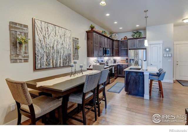 2449 Trio Falls Dr, Loveland, CO 80538 - dining room with recessed lighting, baseboards, and light wood finished floors