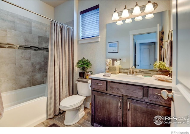 2449 Trio Falls Dr, Loveland, CO 80538 - bathroom with vanity, shower / tub combo with curtain, a textured wall, and toilet